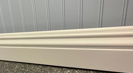 baseboard trim against blue beadboad wainscot baseboard trim