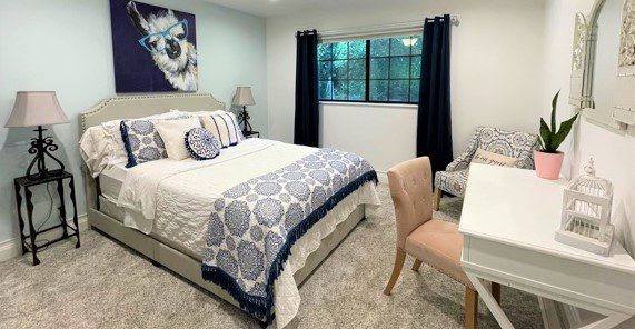 navy blue bedroom with llama picture