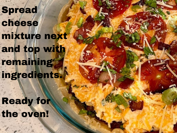 baking a Southern tomato pie, topping it with cheese baking a Southern tomato pie, topping it with cheese