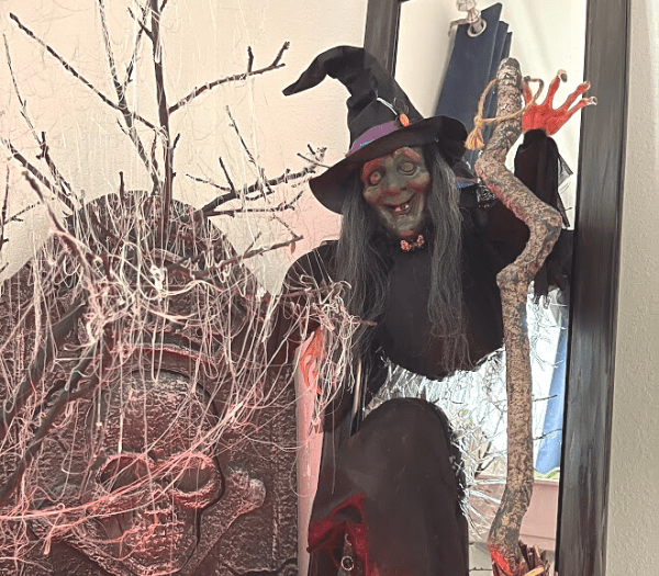 halloween witch breaking out of a mirror